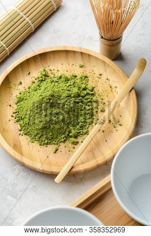 Matcha Green Powder And Tea On Gray Concrete Background