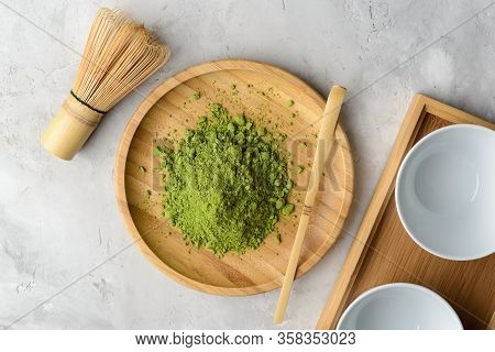 Matcha Green Powder And Tea On Gray Concrete Background