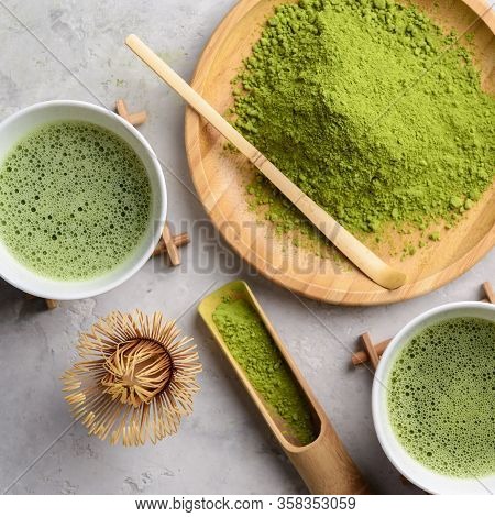 Matcha Green Powder And Tea On Gray Concrete Background