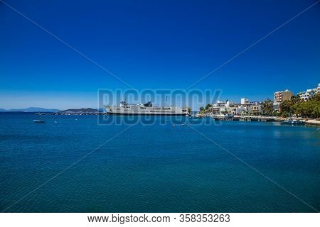 Marmari, Evia, Greece- June 1, 2018: Anchored large ferryboat has opened his front entrance for passengers to exit at the local port. Marmari, Evia, Greece. 