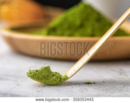 Matcha Green Powder And Tea On Gray Concrete Background