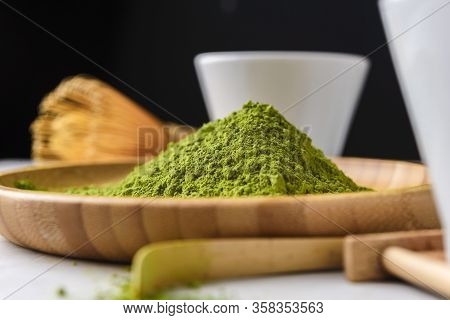 Matcha Green Powder And Tea On Gray Concrete Background