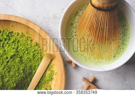 Matcha Green Powder And Tea On Gray Concrete Background