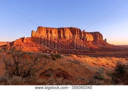 View Of Monument Valley In The Taime Of Beautiful Sunrise On The Border Between Arizona And Utah, Us