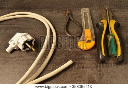 Electric Plug, Wire And Tools For Electrical Installation On The Desktop