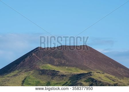 View Over Town Of Heimaey And Volcano Helgafell In Iceland On A Sunny Summer Day