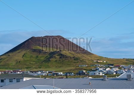 View Over Town Of Heimaey And Volcano Helgafell In Iceland On A Sunny Summer Day