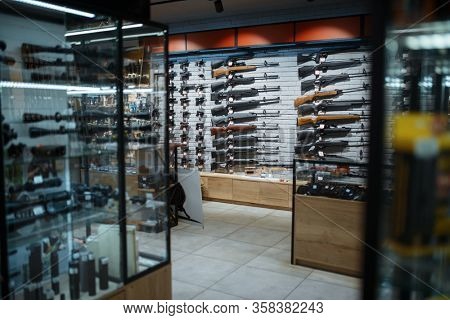 Rifle choice, showcase in gun shop, nobody