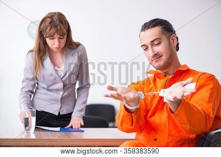 Young man meeting with advocate in pre-trial detention