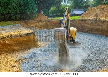 Excavator Digging Bucket Scooping Gravel From In The Building Foundation