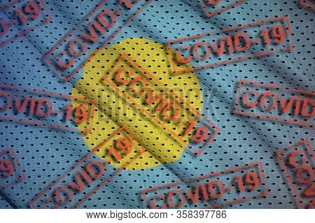 Palau Flag And Many Red Covid-19 Stamps. Coronavirus Or 2019-ncov Virus Concept