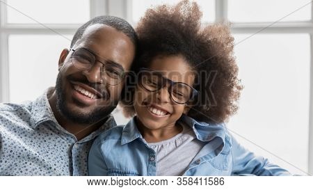 African Father Little Daughter In Glasses With Toothy Smile Portrait
