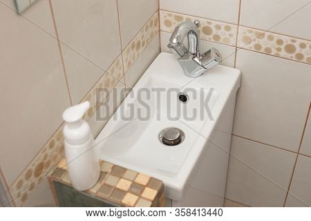 Modern Small White Sink In The Small Bathroom