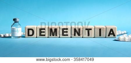 Dementia - Text On Cubes. Drug In Ambula, Tablets In Blisters To Reduce Disease Symptoms