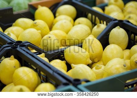 Lemons In Crates On Supermarket. Healthy Food. Vitamins.