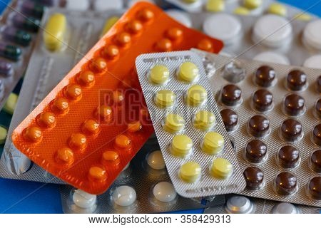 Tablets In A Blister Pack On A Blue Background.  Selective Focus