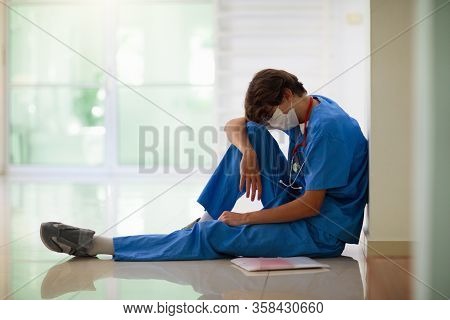 Exhausted Tired Doctor Or Nurse. Virus Outbreak.