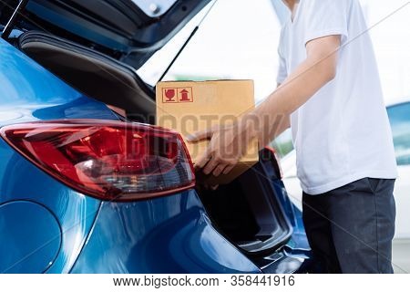 Delivery Man Carrying Cardboard Box For Sending To Receiver Customer By Transportation System Hatchb