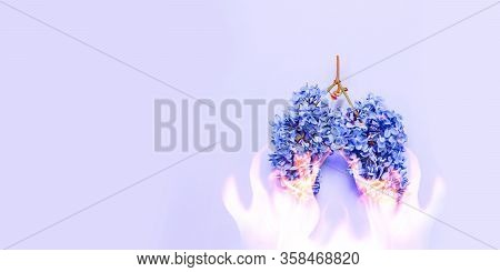 Pneumonia Concept, Burnt Lungs. Human Lungs In The Form Of Lilac Flowers On A Blue Background With C