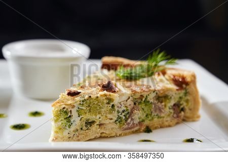 Close Up Of Slice Of Tasty Piece Of Tart With Broccoli And Meat On White Plate. Close Up Of Deliciou