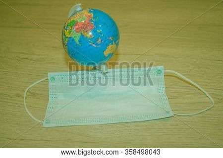 Of Medical Concept During Pandemia. Pattern Of Medical Mask And Globe. Pandemia Of Coronavirus Infec