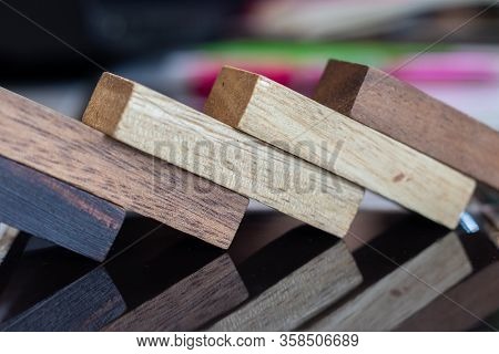 Growing Business Concept. Business Woman Picking Domino Blocks For Filling The Missing Dominus And P