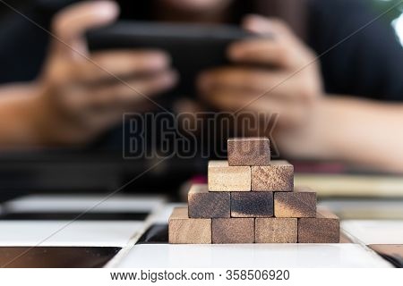 Growing Business Concept. Business Woman Picking Domino Blocks For Filling The Missing Dominus And P