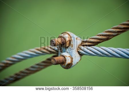Steel Turnbuckle And Steel Sling Anchored Safety Net Into Concrete Block