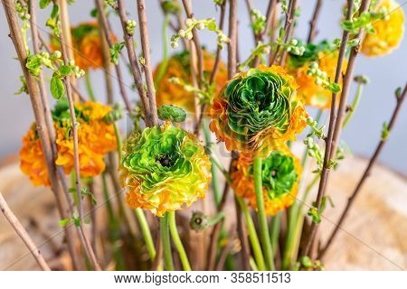Part Of Spring Floristic Arrangement With Lots Of Orange-green Ranunculus Asiaticus, Reinette Orange
