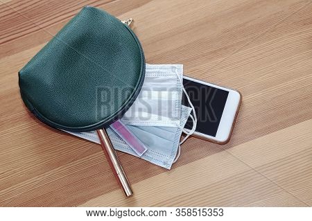 Green Woman Cosmetic Bag With Protruding Two Sanitary Masks, Mobile Phone, Lipstick And Make Up Penc
