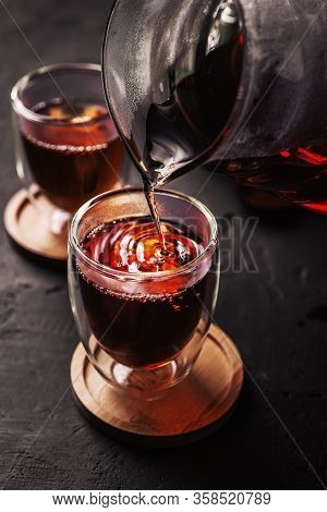Process Brewing Tea, Tea Ceremony, Cup Of Freshly Brewed Black Tea, Dark Moody.hot Water Is Poured F