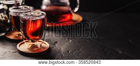 Cup Of Freshly Brewed Black Tea, Dark Moody, Tea Ceremony. Hot Water Is Poured From The Kettle Into 