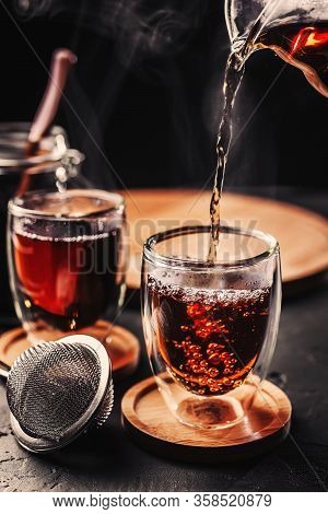 Process Brewing Tea, Tea Ceremony, Cup Of Freshly Brewed Black Tea, Dark Moody.hot Water Is Poured F