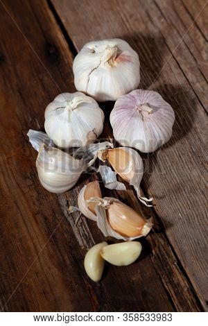 Garlic On A Wooden Background. Food On Table.