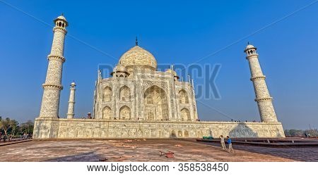 Agra, India - March 5 2018: Wide Lens Shot Of The Famous The Taj Mahal, With Tourists Sighteseeing, 