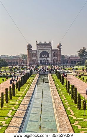 Agra, India - March 5 2018: Tourists Sighteseeing, Exploring And Admiring Famous The Taj Mahal
