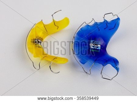 Dental Plates Isolated On White Background.an Alternative To Braces For Aligning Teeth. Dentures Of 