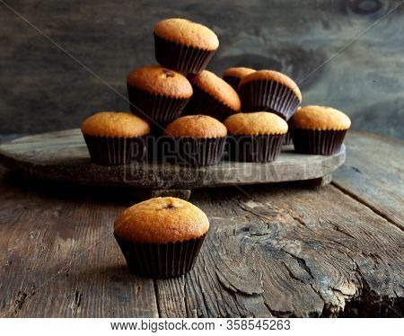 Muffins - Delicious Pastries. Delicious Dessert On The Table - Homemade Muffins. Portioned Cupcakes.