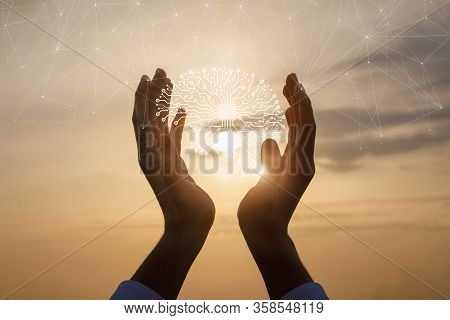 The Concept Of Support For Artificial Intelligence. Hands Supports The Brain Of Artificial Intellige