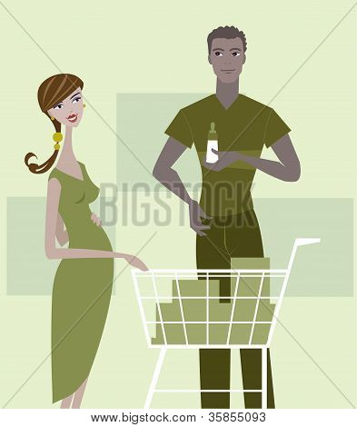 一个怀孕的女人和男人的婴儿用品购物