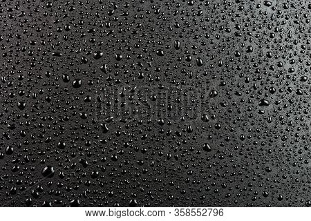 Water Drops On Abstract Flat Black Hydrophobic Surface Macro Background