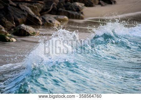 Colorgraded Waves Splashing On The Shore During Sunset