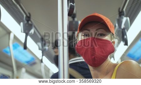 Woman Travel Caucasian Ride At Overground Train Airtrain With Wearing Protective Medical Mask. Girl 