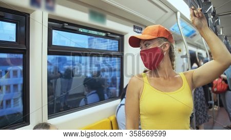 Woman Travel Caucasian Ride At Overground Train Airtrain With Wearing Protective Medical Mask. Girl 