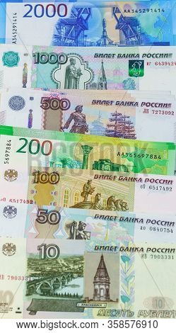 Background Of Spread Out Russian Banknotes Of Different Denominations. Ruble