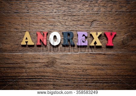 Anorexy word on a wood table.
