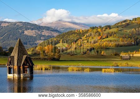 autumn pond under the mountains, Murau district,
Styria, Austria