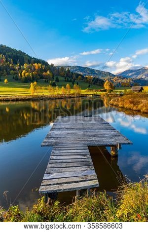 autumn pond under the mountains, Murau district,
Styria, Austria