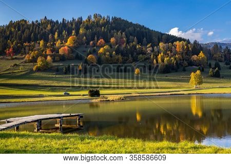 autumn pond under the mountains, Murau district,
Styria, Austria