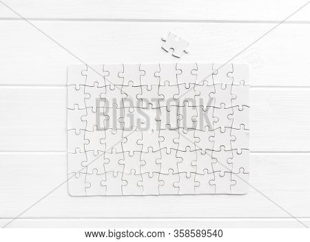 Top view of white jigsaw puzzle